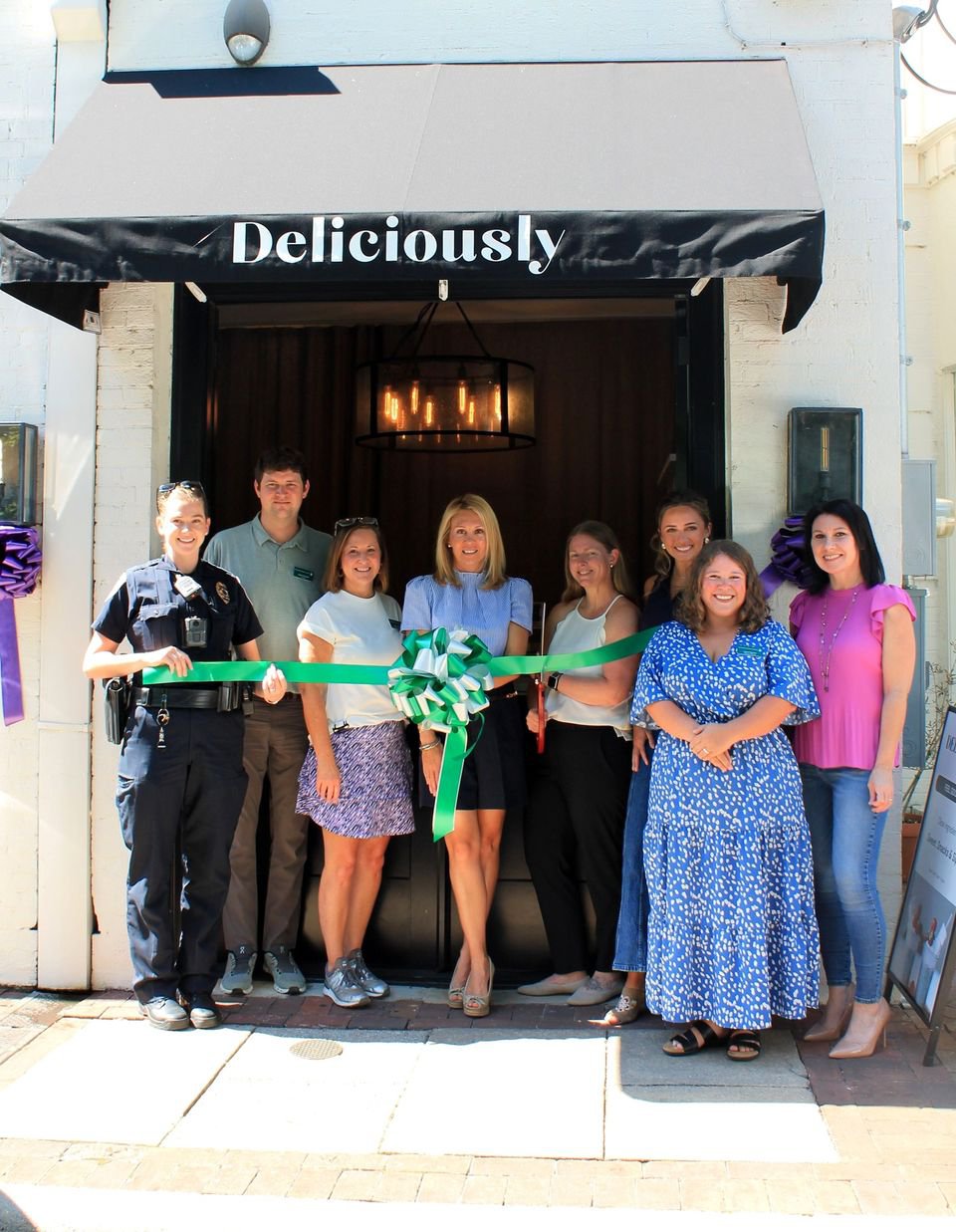 Deliciously ribbon cutting.jpg